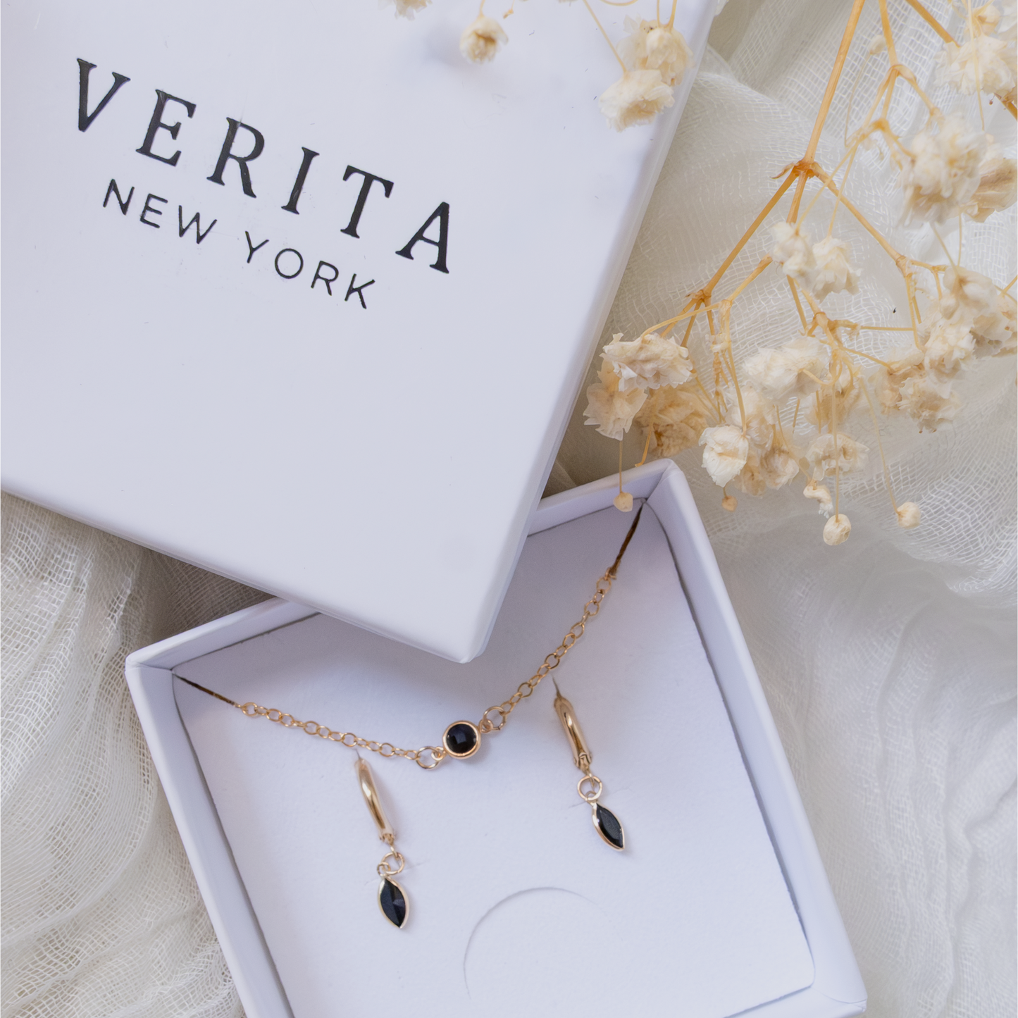 Jewelry set with necklace and earrings in a Verita New York box.