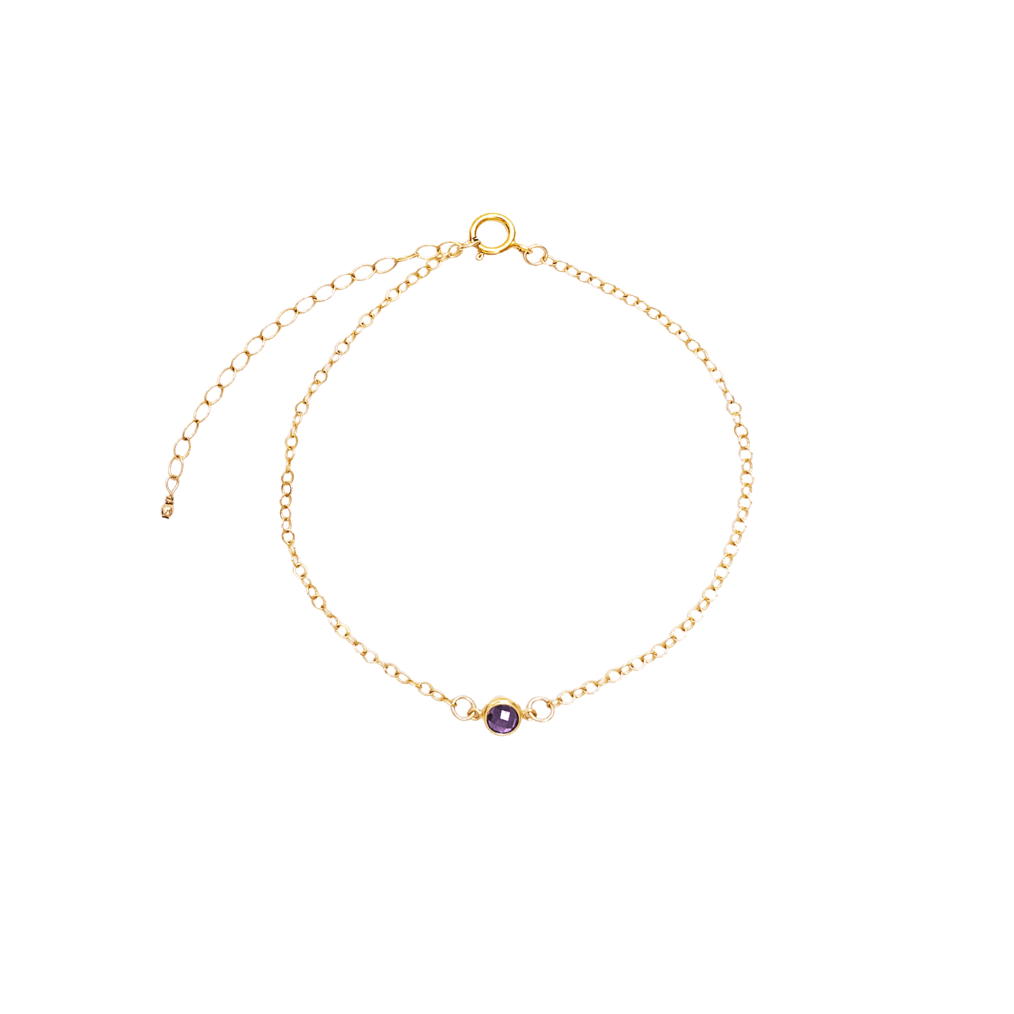 Gold bracelet with a purple gemstone on a white background