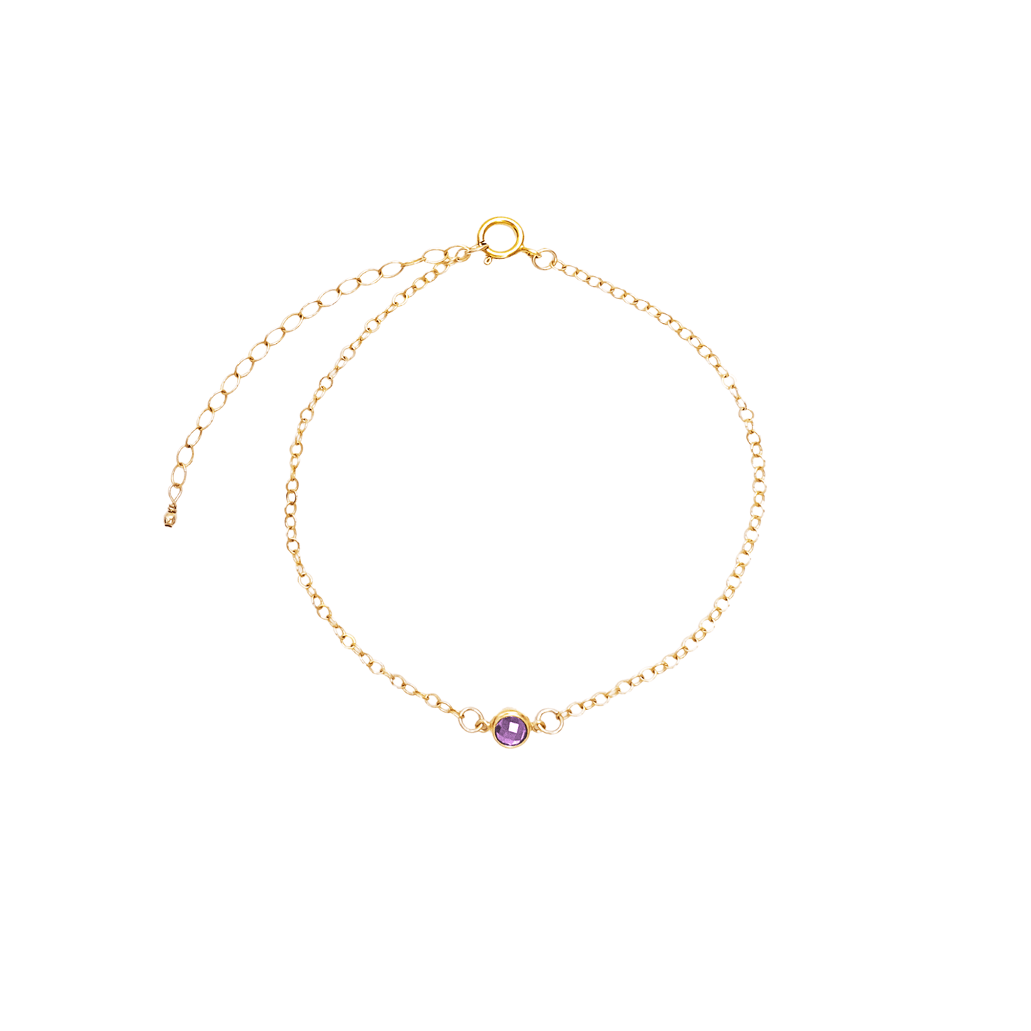 Gold bracelet with a purple gemstone on a white background