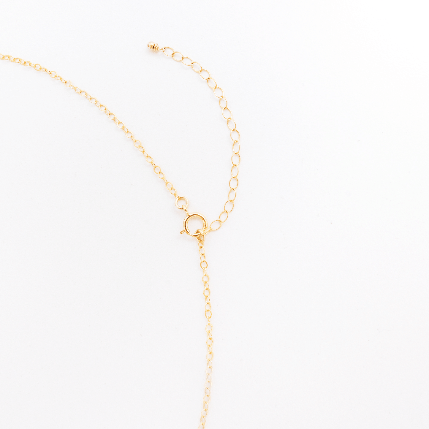 Gold necklace on a white background
