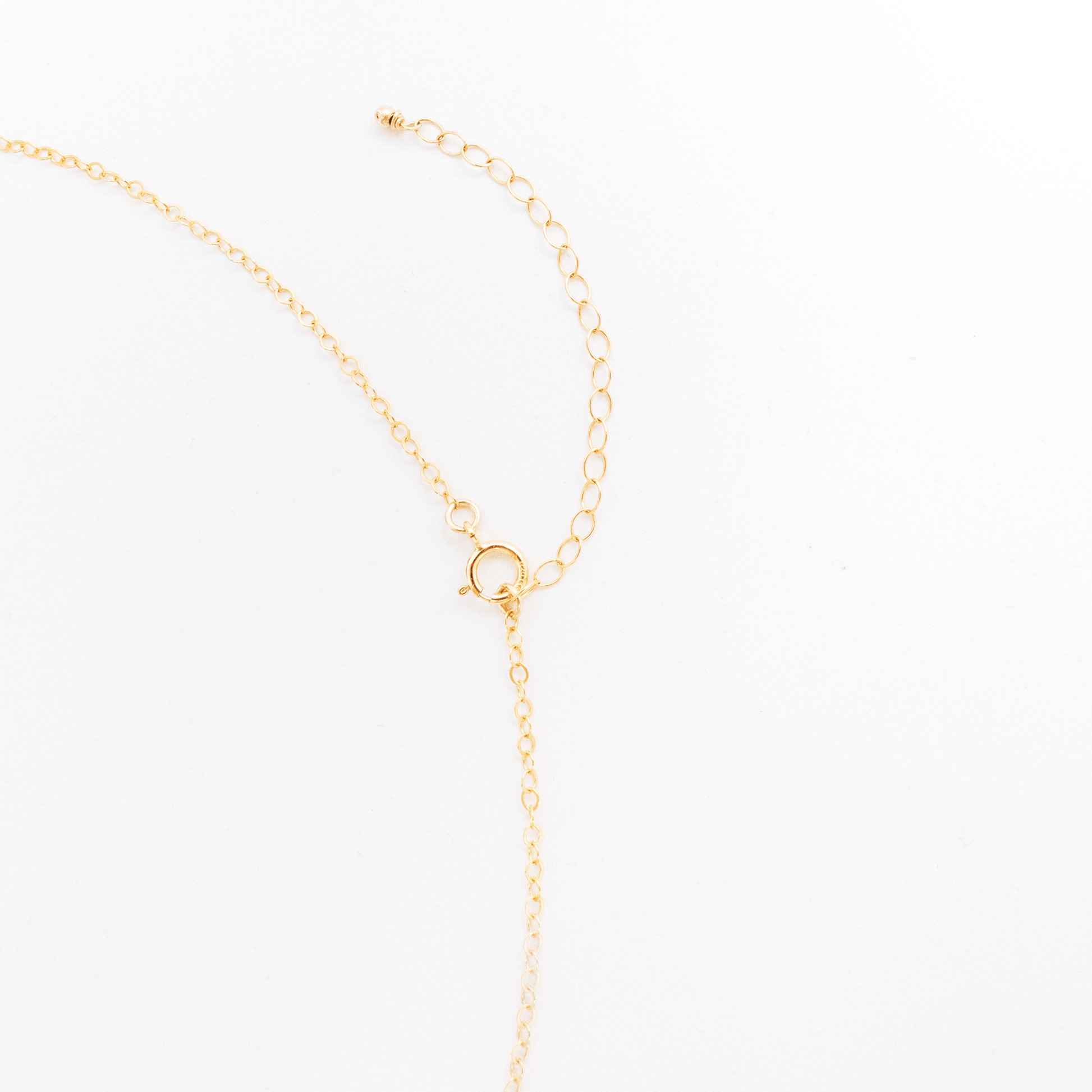 Gold necklace on a white background