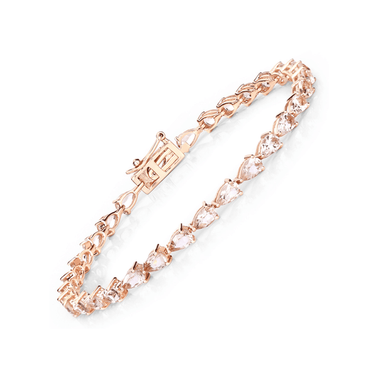 Rose gold bracelet with clear gemstones on a white background
