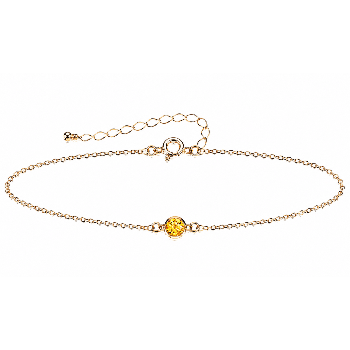 Gold bracelet with a small gemstone on a white background